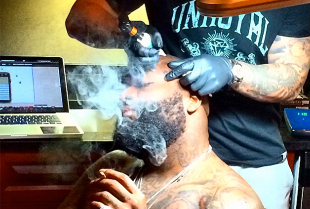 Rick Ross Went and Got Nipsey Hussles Face Tattoo on his leg Video   YARDHYPE
